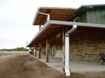 6 Inch Seamless K-Style Gutter in Galvalume connected to a Custom Rainwater Collection System